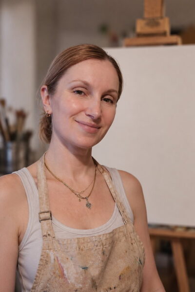 Olha Hnatiuk in her studio, in front of a blank canvas